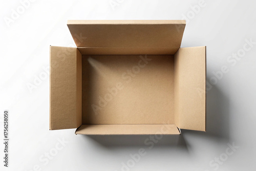Open cardboard box with blank space: Overhead view of an open cardboard box, revealing empty interior. The neutral backdrop complements the simplicity of the box.