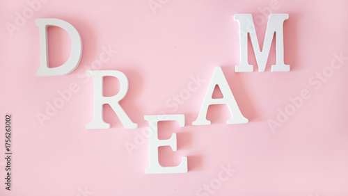 white letters on the pink background
