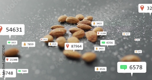 Displaying whole almonds floating at kitchen counter, with coarse salt crystals and overlay icons