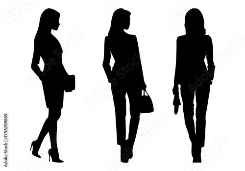 Vector silhouettes of three women, business people standing elegantly in black isolated on white background