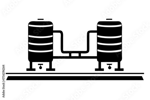 Two storage tanks connected by pipes