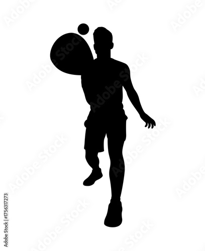 Silhouette of a male tennis player in action hitting a forehand shot with a tennis ball and racket