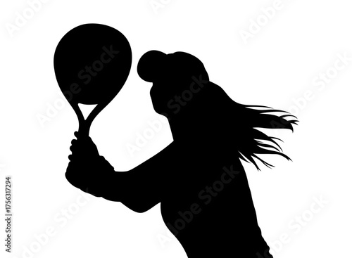 Silhouette of a female tennis player in action hitting a powerful forehand shot with her racket