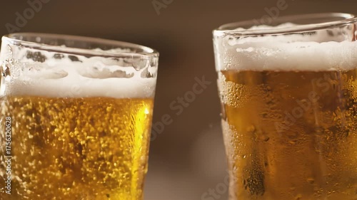 Wallpaper Mural Cheers with two frosty beer mugs clinking together, capturing the joyful moment of celebration, camera zooms in on the action and bubbles rising Torontodigital.ca