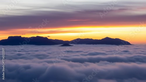Sunrise Above the Clouds: Majestic Mountain Peaks