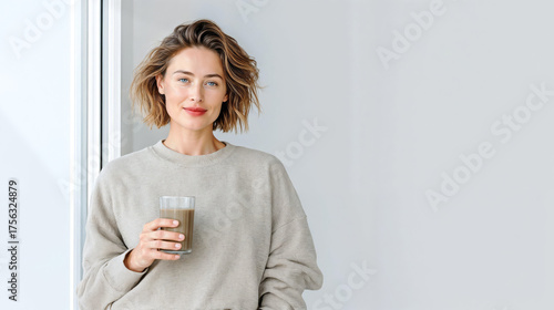 Calm morning with a drink in neutral interior 