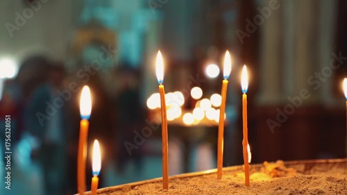 Close up of group of lit candles inside an Orthodox church. Symbolizing faith, remembrance, and the emotional power of spiritual connection in religion