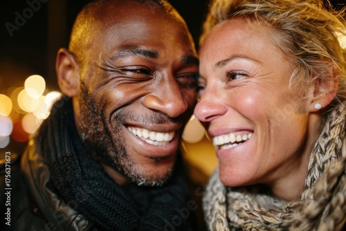 Couple enjoying a joyful moment together in a city at night surrounded by soft bokeh lights