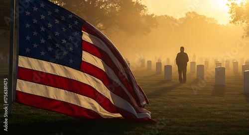 Man walks through misty cemetery with American flag waving in foreground on a solemn Memorial Day morning, honoring fallen heroes and remembering their sacrifice.
