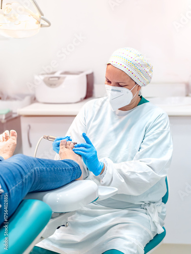 Female podiatrist doing chiropody in her podiatry clinic.