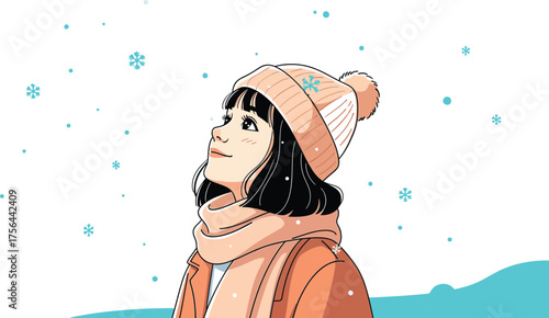 Young woman wearing a warm beanie and scarf looking up at falling snowflakes in winter