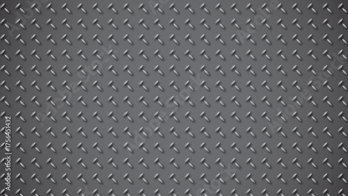 Close up texture of a dark gray metal surface with a raised diamond pattern