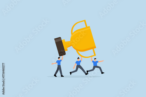 Team achievement, team members in the company commemorate assistance in lifting large victory trophy