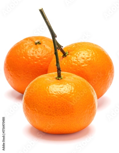 Three vibrant citrus fruits, tangerines, with stem and leaves on a white background