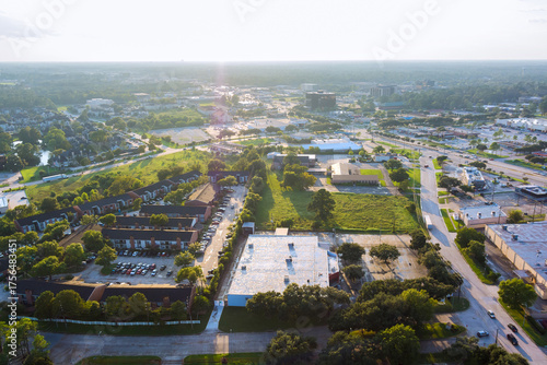 Картината върху платно Panoramic view of Houston suburban area in Harris County, Texas, residential buildings, parking lots, green spaces, urban infrastructure commercial residential wide roadways