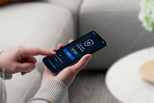 User entering 2FA code on smartphone screen with security shield icon, representing secure login, verification, and multi-factor authentication