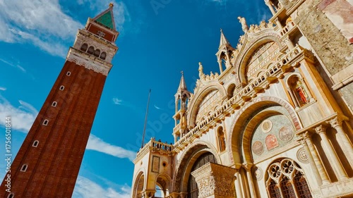 Revealing the magnificent Campanile di San Marco (St Mark's Campanile) and Basilica di San Marco (St Mark's Basilica) in Venice, Italy, on a bright sunny day