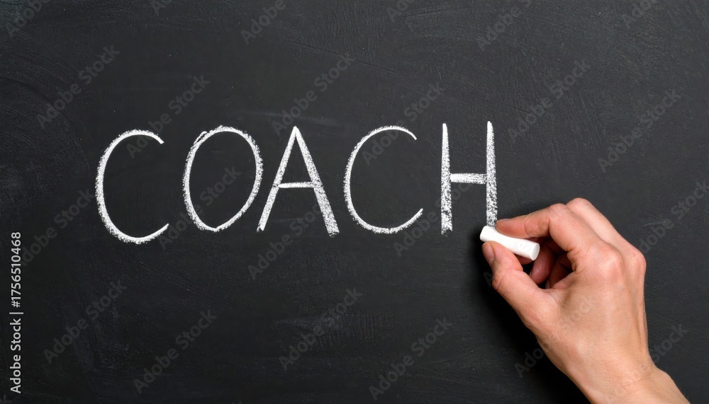 Fototapeta premium The word coach being written in chalk on a blackboard, symbolizing mentorship, guidance, training, education, and professional support