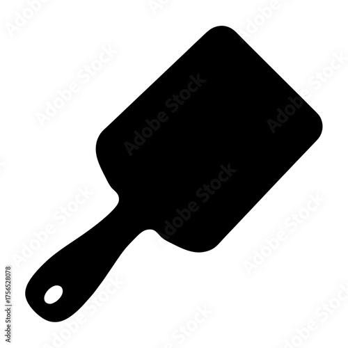 Black silhouette of a serving utensil, a spatula or cake server, at an angle