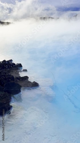 Steaming hot water pool near Blue Lagoon Iceland vertical