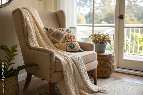 A warm and inviting corner setup featuring a comfortable sofa with soft knitted blanket, and decorative pillow with natural light , comfort and lifestyle concepts 