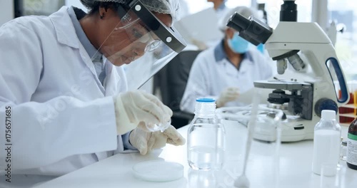 Scientist, woman and chemical analysis with petri dish for chemistry, testing and medical research. Biotech, laboratory and PPE with DNA inspection for pathology experiment, synthesis or microbiology