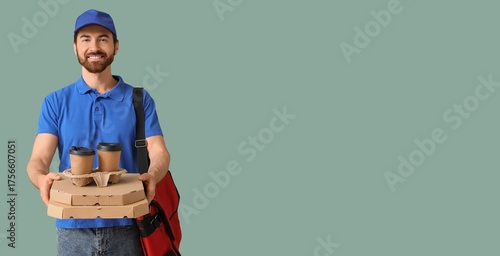 Male courier holding pizza ...