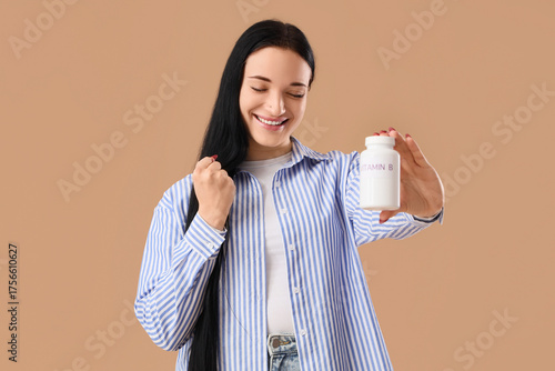 Happy young woman with vita...