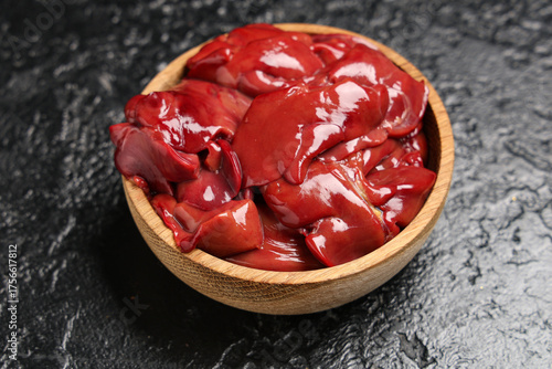 Raw chicken livers in a woo...