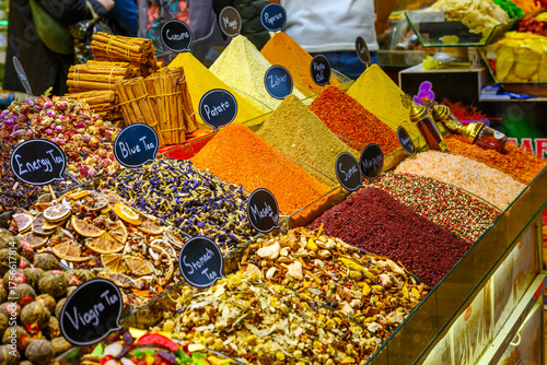 Fototapeta Naklejka Na Ścianę i Meble -  A market stall of colorful spices, herbs and teas inside the covered Spice Bazaar in Istanbul, Turkey.