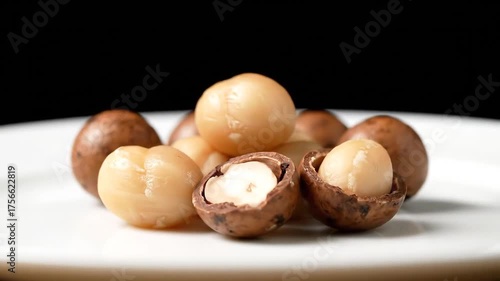 Macadamia Nuts on a Plate A CloseUp Look at a Healthy Snack.
