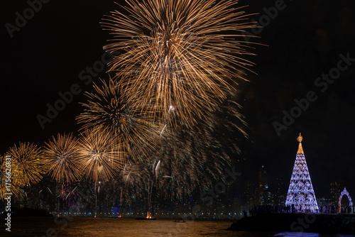 Christmas tree and fireworks on New Year's Evein Balneario Camboriu Santa Catarina Brazil.