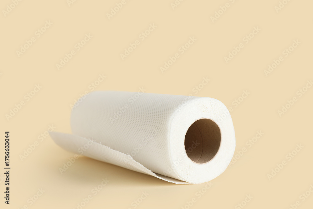 Fototapeta premium Roll of paper towels on beige background