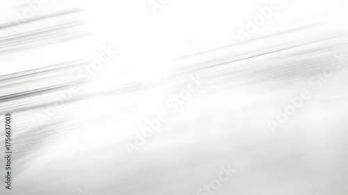Abstract background with blurred motion blur lines in white and gray.