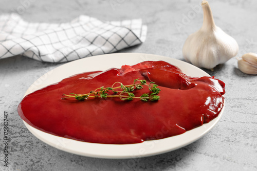 Plate with raw liver and th...