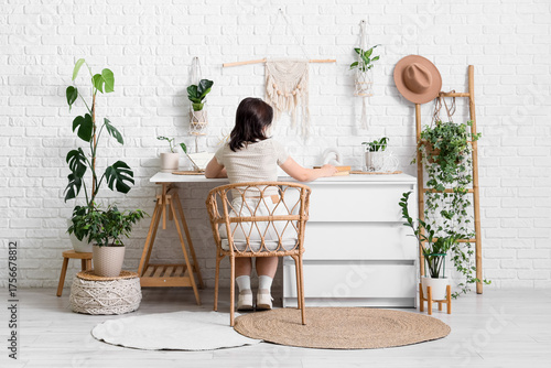 Young woman with books and ...