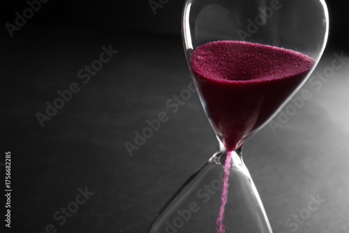 Hourglass with pink crystal...