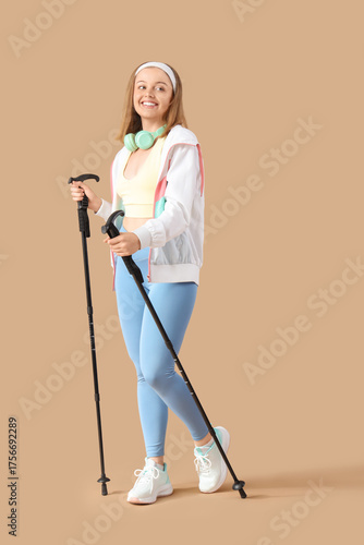 Sporty young woman with wal...