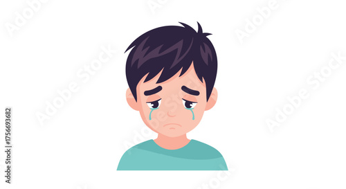 Sad young boy with tears rolling down his cheeks looking unhappy.