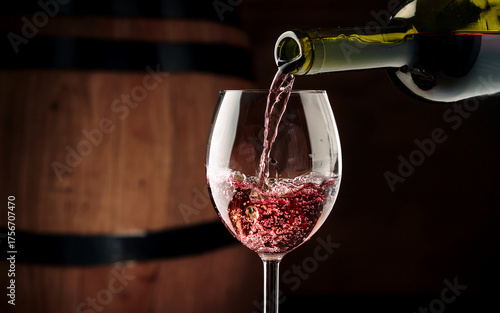 red wine pouring into wine glass