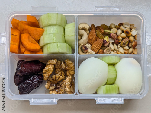 Healthy lunch box or Healthy diet box or Healthy tiffin box (egg, cashew nut, almond, peanut, carrot, cucumber, date fruit) 