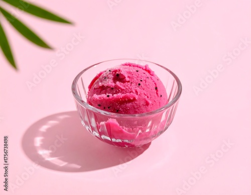 Vibrant Pink Dragon Fruit Sorbet Delight in a Crystal Bowl with Tropical Leaf Shadow