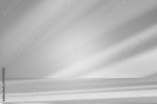 Wall interior background, studio and backdrops show products.with shadow from window color white and grey. background for text insertion and presentation product	
