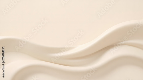 Flowing elegant creamy fabric with soft folds, studio shot