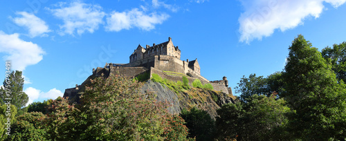 Panoramic view of the historic Edinburgh Castle lookin up from the Princes Gardens.