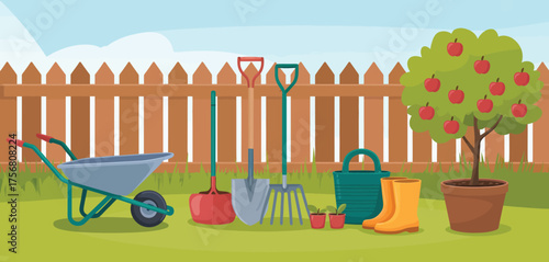 Gardening tools and supplies arranged in a backyard with a wooden fence and fruit tree