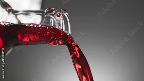 Wallpaper Mural Red liquid pouring from a glass bottle in motion wine Torontodigital.ca