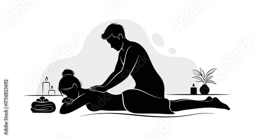 Silhouette of a person giving a massage to another person with candles, towels, and a plant