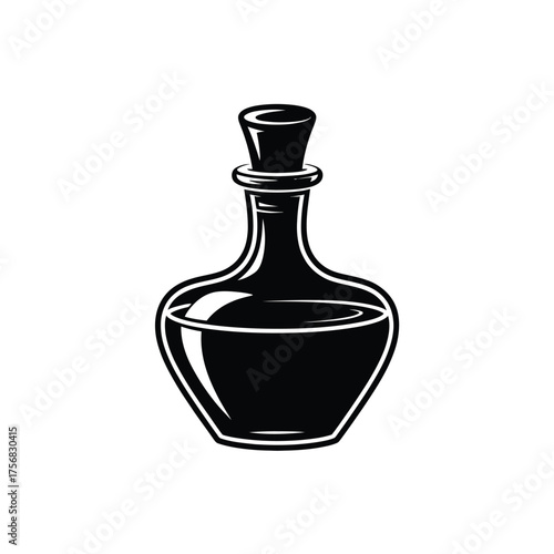 Vintage black glass potion bottle with cork stopper filled with dark liquid