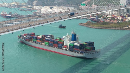 Cargo Ship Navigating Near Stonecutters Bridge, Revealing Hong Kong's Vibrant Maritime Landscape And Global Trade Dynamics. Container Vessel Passing Stonecutters Bridge, Highlighting Hong Kong's